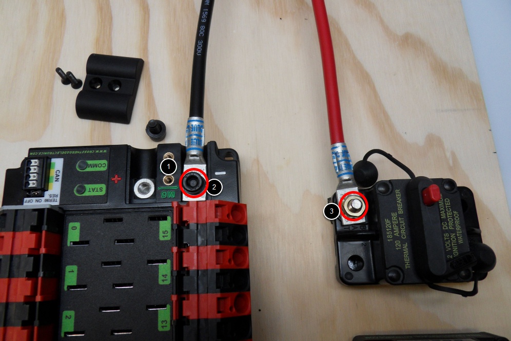 Highlights the location of the terminal lugs on the PDP and circuit breaker.